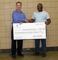 Viracon President Kelly Schuller (left) with Viracon's 2015 Employee of the Year, Yao Baba (right)