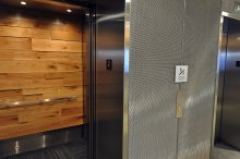  In the elevator banks, walls clad in sleek Banker Wire mesh are juxtaposed with warm-looking wood paneling, creating a contemporary space that embodies the company’s identity as a state-of-the-art workplace.