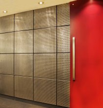 Supported by the invisible brackets in each tile’s four corners, the mesh cladding brings texture and visual depth to the space.