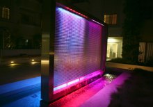  The RGB-lit wire mesh waterfall highlights the textures and sounds throughout this central space.