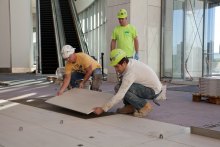 TEC® products were used to install 2-foot-by-4-foot tile in Cobo's atrium. 