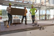 TEC® products were used to install 2-foot-by-4-foot tile in Cobo's atrium. 